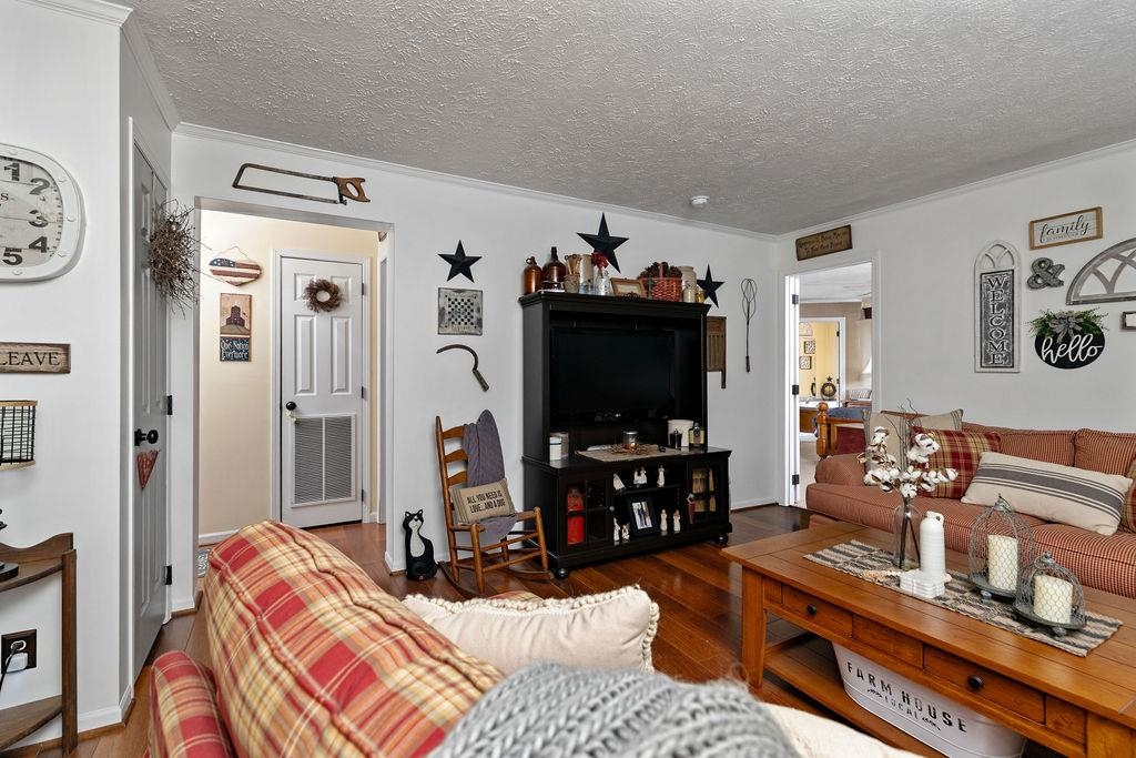 264 Steeles Fort Road Raphine, VA 24472 - Photo 11 of 50 a bedroom with furniture and a flat screen tv