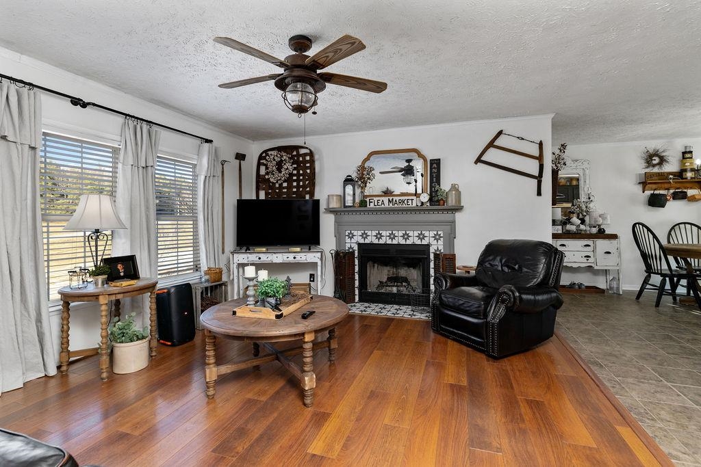 264 Steeles Fort Road Raphine, VA 24472 - Photo 14 of 50 a living room with furniture a table and a fireplace