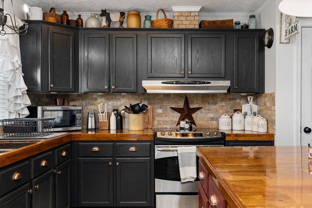 264 Steeles Fort Road Raphine, VA 24472 - Photo 23 of 50 a kitchen with stainless steel appliances granite countertop a refrigerator and a stove top oven