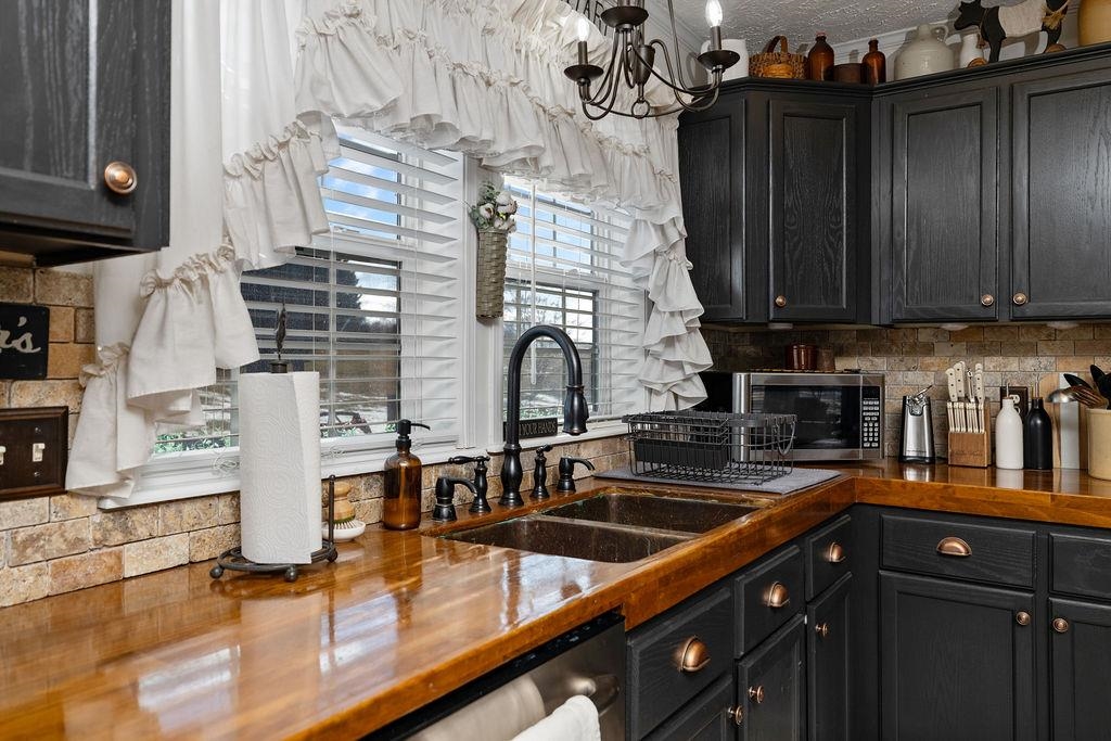 264 Steeles Fort Road Raphine, VA 24472 - Photo 24 of 50 a kitchen with stainless steel appliances granite countertop a sink a stove and cabinets