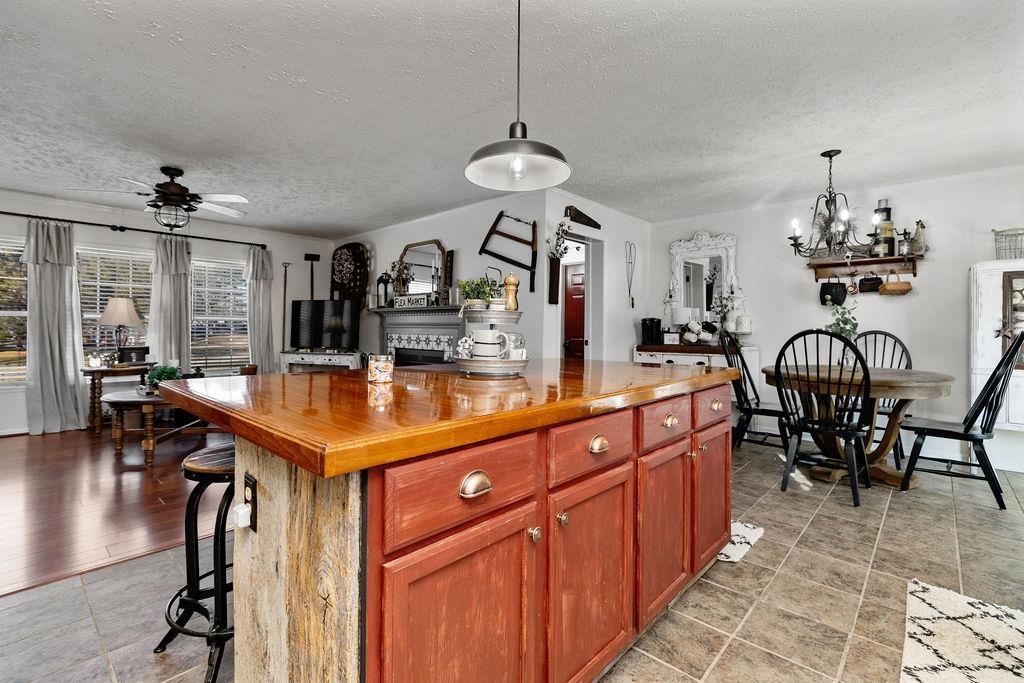 264 Steeles Fort Road Raphine, VA 24472 - Photo 25 of 50 a kitchen with stainless steel appliances a table chairs and chandelier