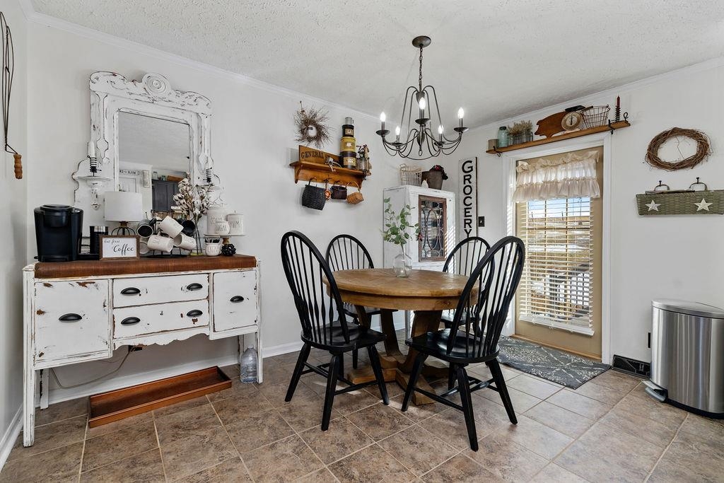 264 Steeles Fort Road Raphine, VA 24472 - Photo 26 of 50 a view of a dining room with furniture and chandelier