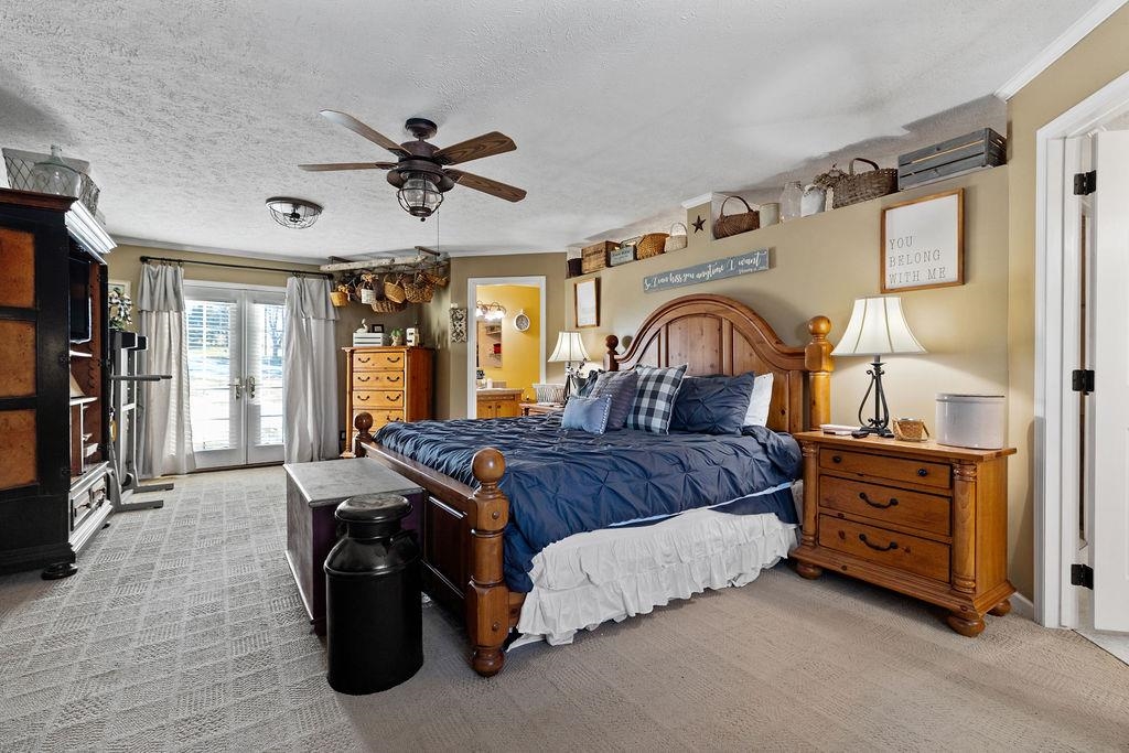 264 Steeles Fort Road Raphine, VA 24472 - Photo 28 of 50 a spacious bedroom with a bed next to a window