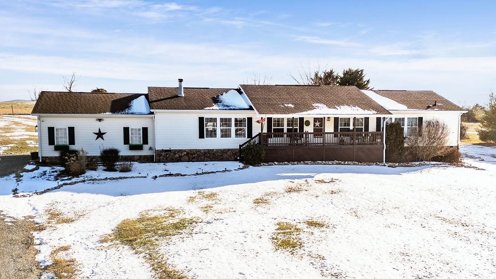 264 Steeles Fort Road Raphine, VA 24472 - Photo 3 of 50 a front view of a house with a yard covered with snow