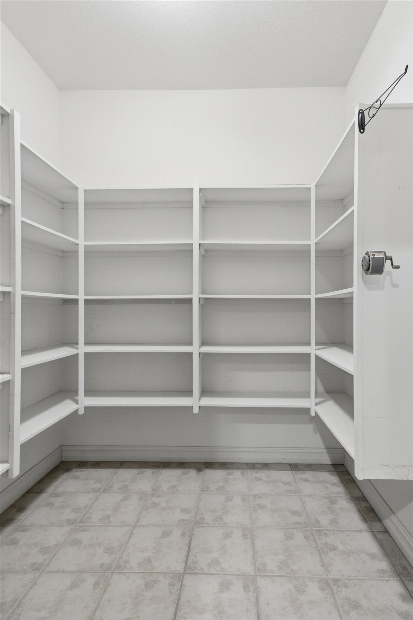 17875 East 589 Road Inola, OK 74036 - Photo 14 of 73 Expansive pantry featuring multi-level shelving, bright white walls, and tiled flooring