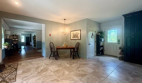 a living room with furniture window and wooden floor