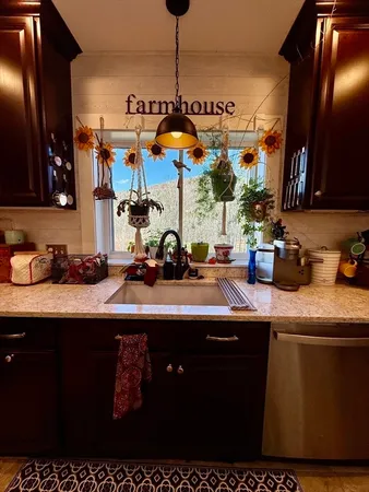 a bathroom with a sink mirror vanity and toilet