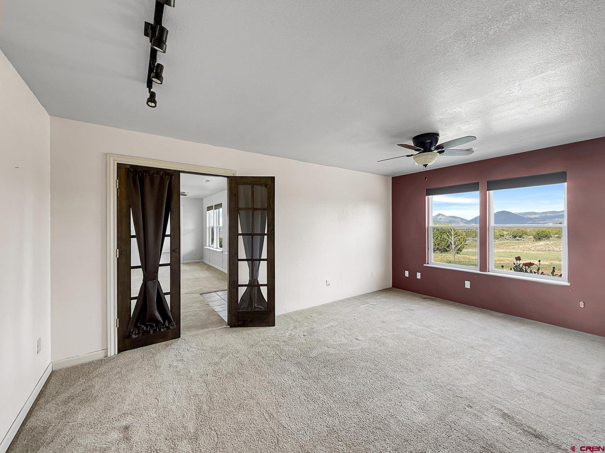 32310 B50 Road Crawford, CO 81415 - Photo 25 of 45 an empty room with windows and closet
