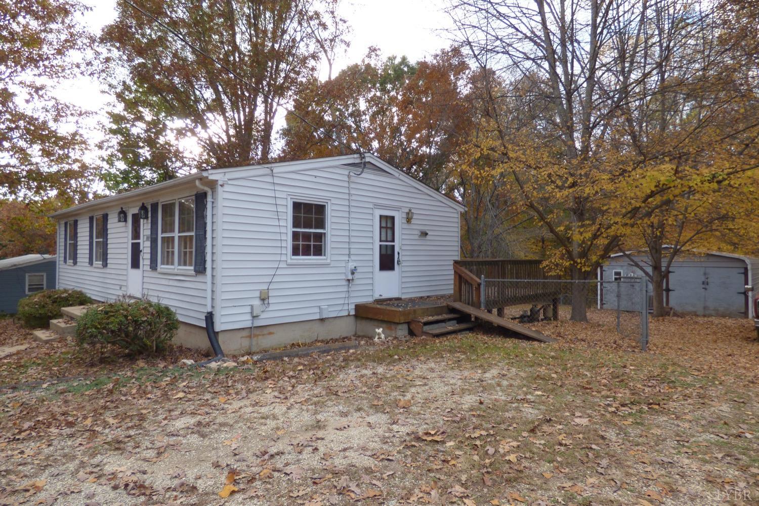 1381 Boxwood Farm Road Amherst, VA 24521 - Photo 12 of 20 a view of a house with a yard and wooden fence