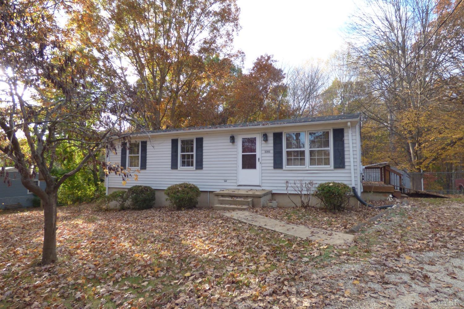 1381 Boxwood Farm Road Amherst, VA 24521 - Photo 17 of 20 a view of a house with a backyard