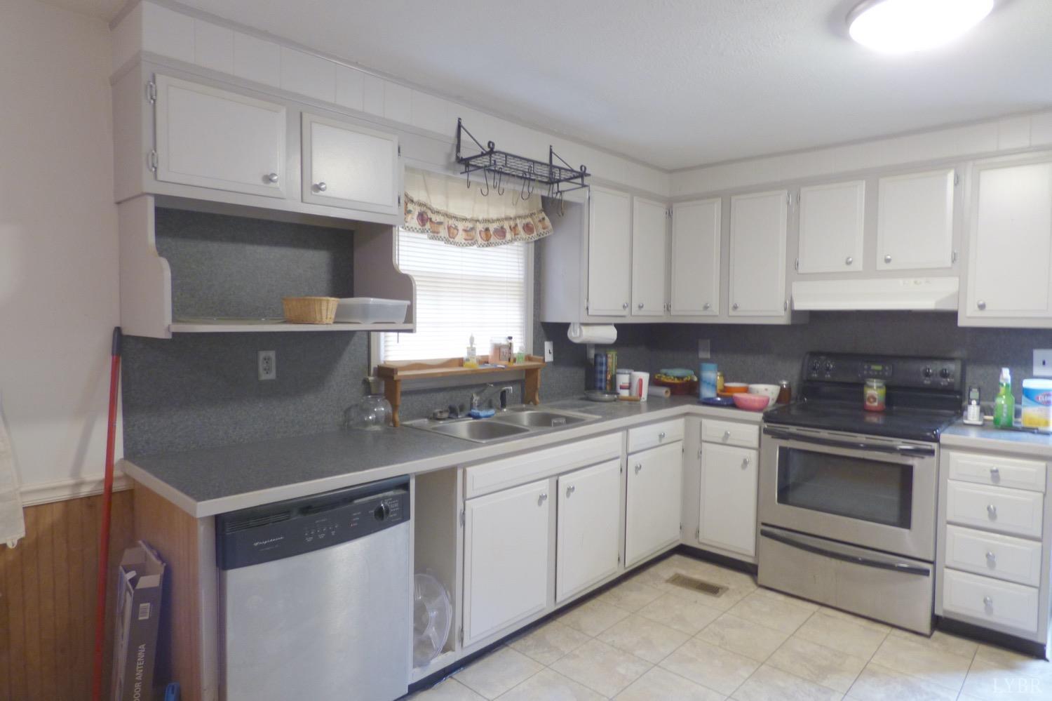 1381 Boxwood Farm Road Amherst, VA 24521 - Photo 3 of 20 a kitchen with appliances a sink and cabinets