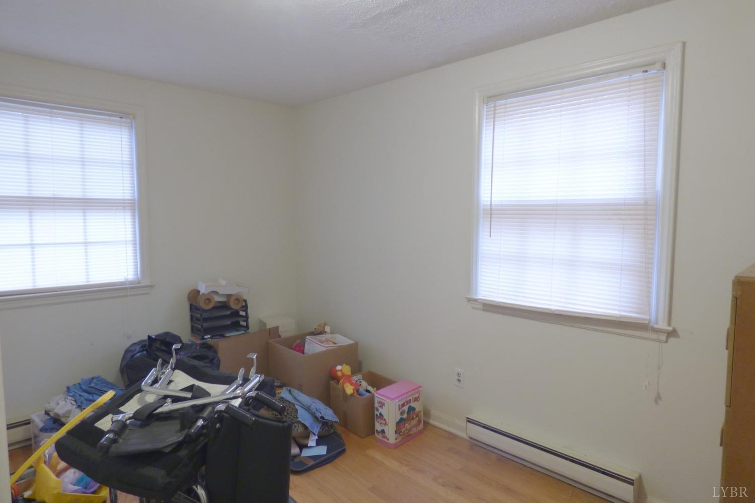 1381 Boxwood Farm Road Amherst, VA 24521 - Photo 9 of 20 a view of a room with rack on the wall and a window