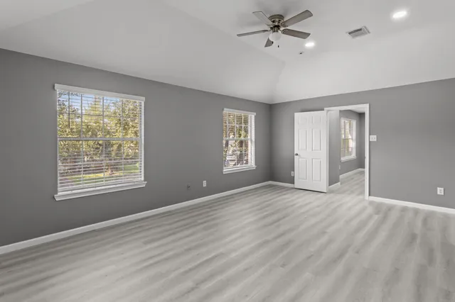 a view of an empty room with a window