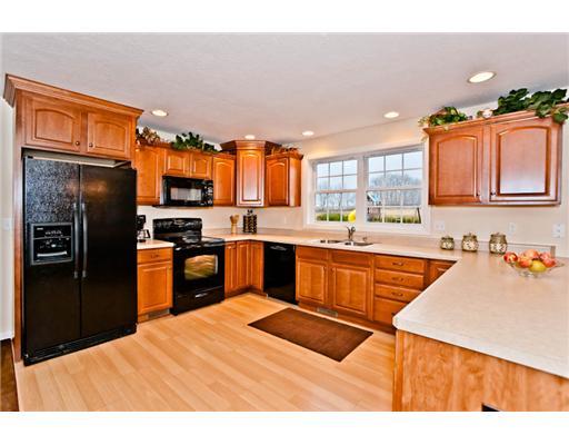 132 Buttercup Road Butler, PA 16001 - Photo 8 of 18 Kitchen. MAPLE KITCHEN INCLUDES RECESSED LIGHTING, WOOD LAMINATE FLOORS, TONS OF COUNTER SPACE AND A BUILT IN DESK AREA