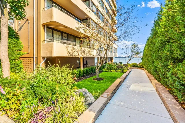 a view of a pathway both side of the house
