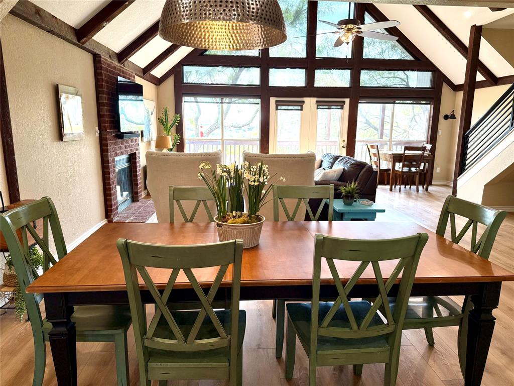 105 Turnberry Loop Graford, TX 76449 - Photo 11 of 34 a view of a dining room with furniture a chandelier and wooden floor