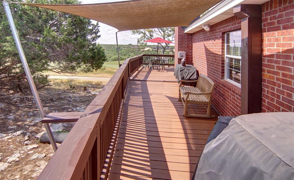105 Turnberry Loop Graford, TX 76449 - Photo 18 of 34 a balcony with wooden floor