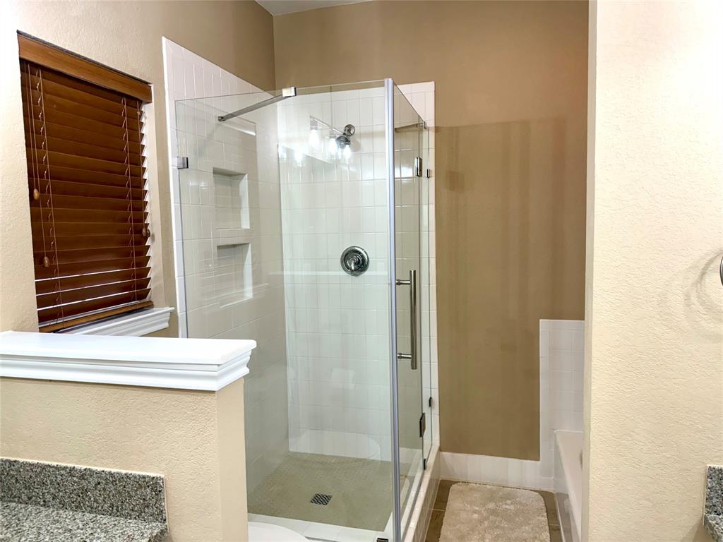 105 Turnberry Loop Graford, TX 76449 - Photo 21 of 34 a bathroom with a shower and a sink