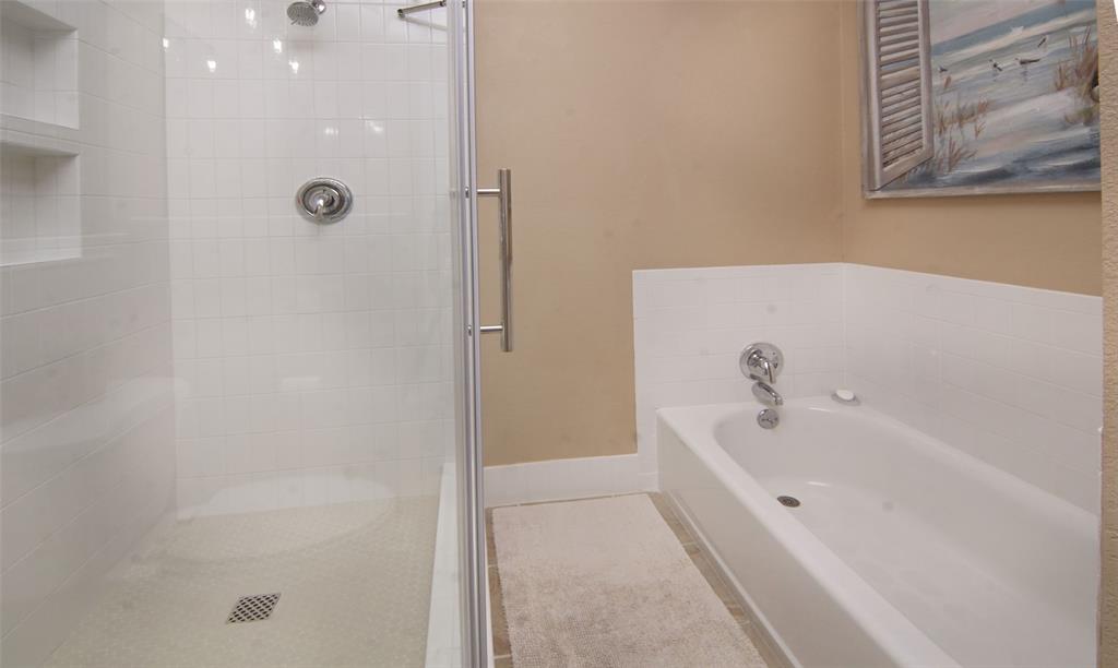 105 Turnberry Loop Graford, TX 76449 - Photo 24 of 34 a bathroom with a tub and shower