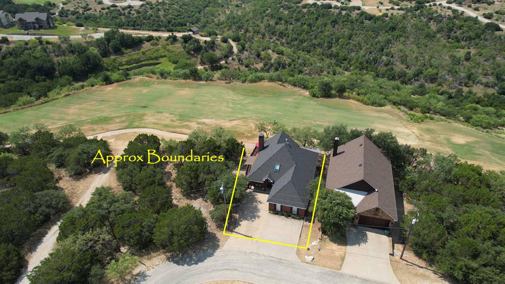 105 Turnberry Loop Graford, TX 76449 - Photo 25 of 34 an aerial view of residential houses with outdoor space and trees
