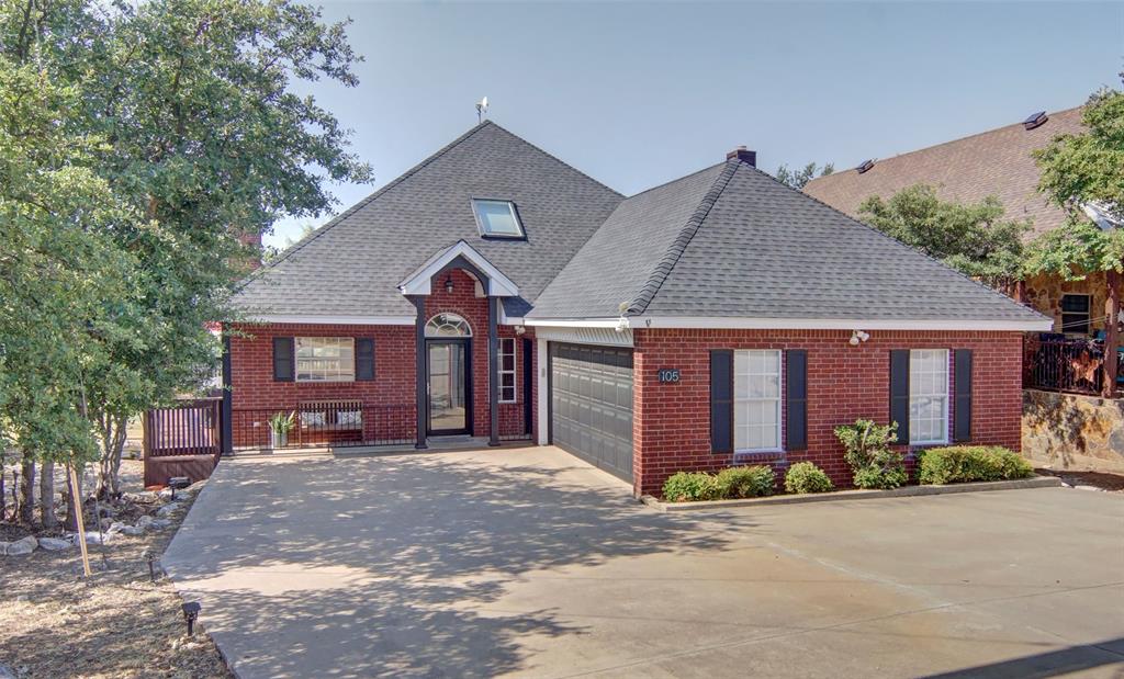 105 Turnberry Loop Graford, TX 76449 - Photo 3 of 34 a front view of a house with yard