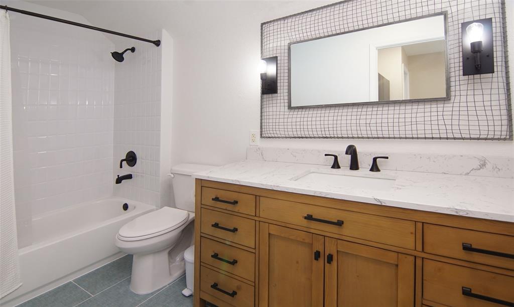 105 Turnberry Loop Graford, TX 76449 - Photo 33 of 34 a bathroom with a sink a toilet and shower