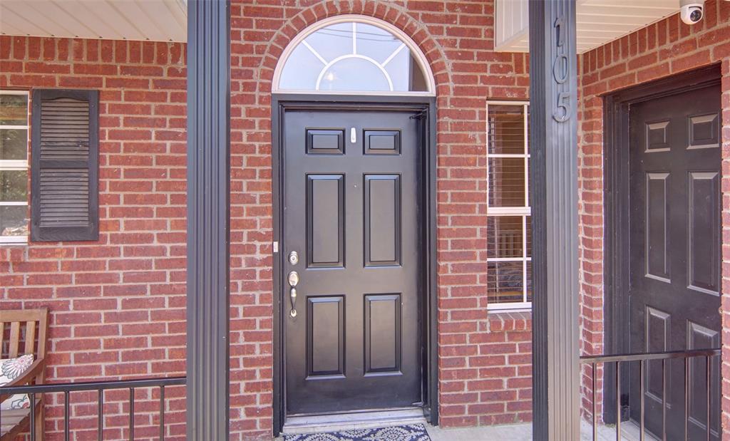 105 Turnberry Loop Graford, TX 76449 - Photo 6 of 34 a front view of a building with a glass door