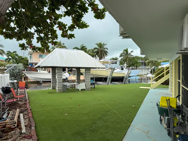 a view of a house with a yard porch and sitting area
