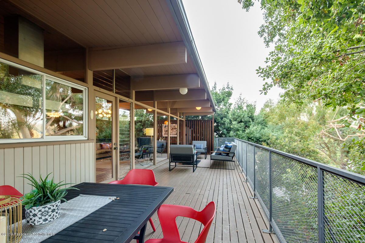 300 Anita Drive Pasadena, CA 91105 - Photo 15 of 28 a balcony with wooden floor table and chairs