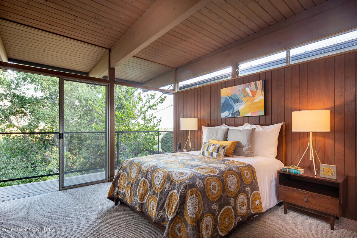 300 Anita Drive Pasadena, CA 91105 - Photo 16 of 28 a bed sitting in a bedroom next to a window