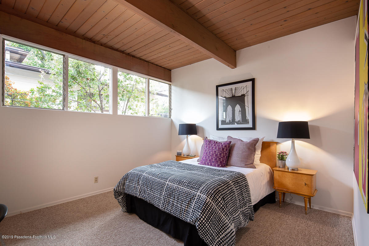 300 Anita Drive Pasadena, CA 91105 - Photo 18 of 28 a bedroom with a bed and a night stand