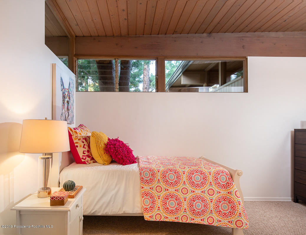 300 Anita Drive Pasadena, CA 91105 - Photo 19 of 28 a bedroom with a bed and a night stand