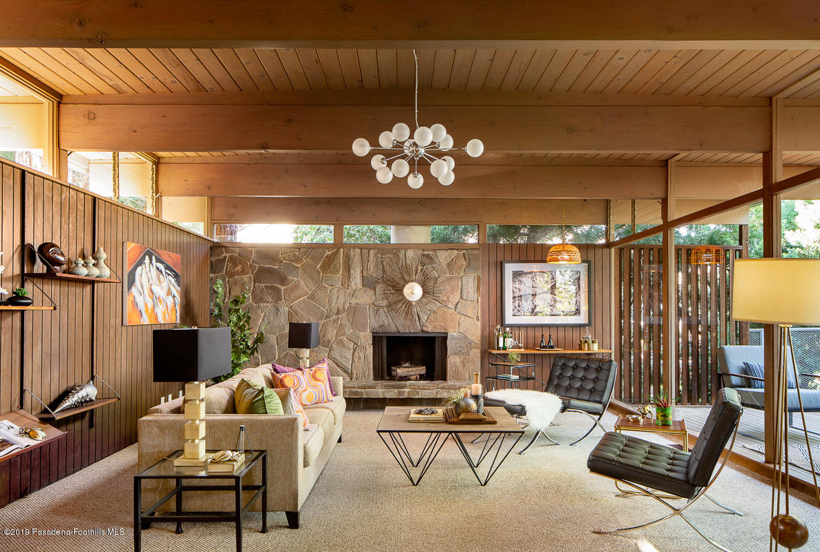 300 Anita Drive Pasadena, CA 91105 - Photo 3 of 28 a living room with furniture chandelier and a fireplace