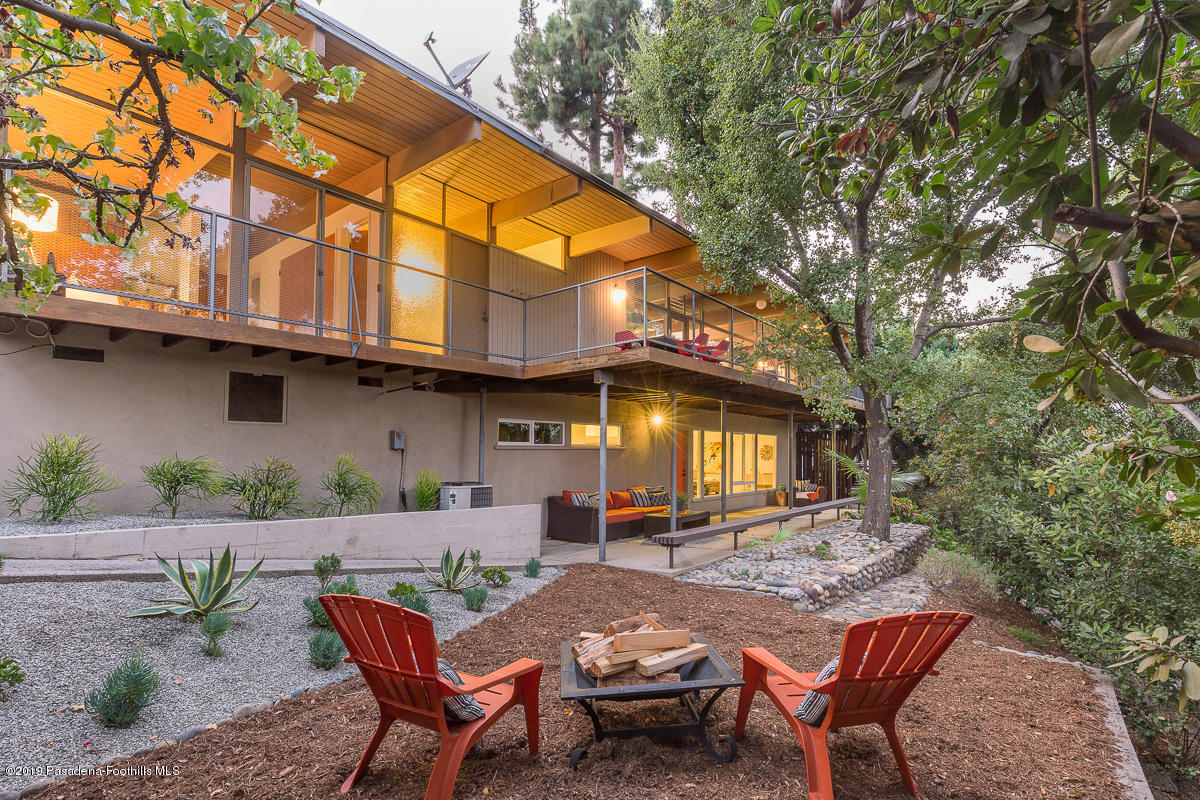 300 Anita Drive Pasadena, CA 91105 - Photo 26 of 28 a backyard of a house with table and chairs