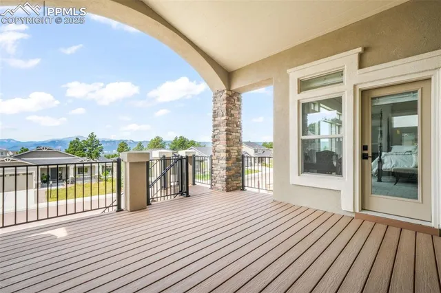 a view of a balcony with wooden floor