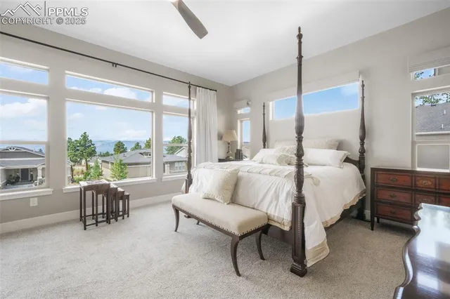 a bed room with a bed and a table