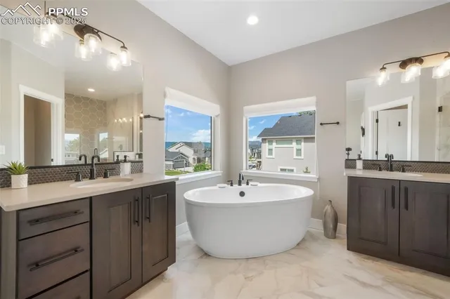 a large kitchen with a sink and window
