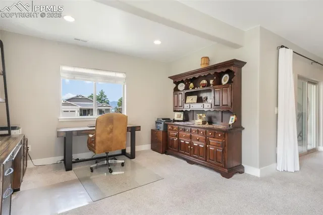 a view of workspace with furniture and window
