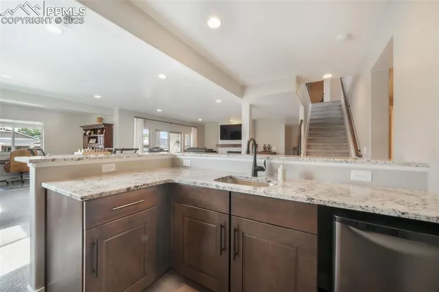 a kitchen with a sink stove and cabinets
