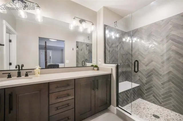 a bathroom with double sink and a mirror