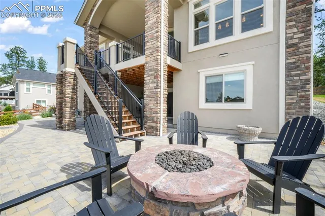 a view of a patio with couches table and chairs