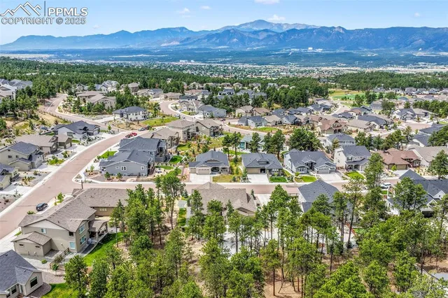 a view of a city with mountains in the background