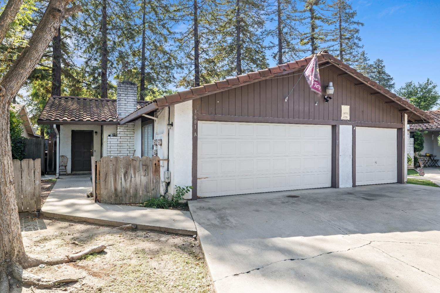 3601 Agate Drive Modesto, CA 95356 - Photo 16 of 20 a front view of a house with a yard and garage