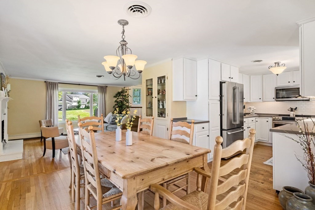 14 Highview Drive Hingham, MA 02043 - Photo 15 of 41 a view of a dining room with furniture a chandelier and wooden floor