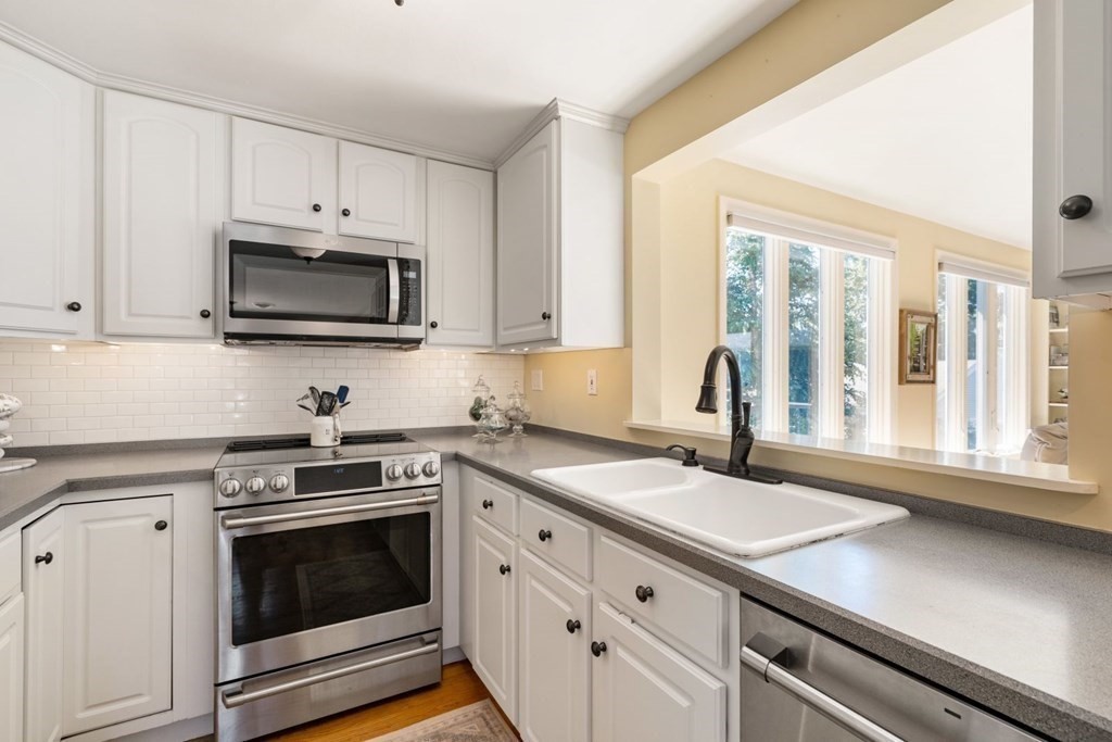 14 Highview Drive Hingham, MA 02043 - Photo 20 of 41 a kitchen with granite countertop a sink appliances and cabinets