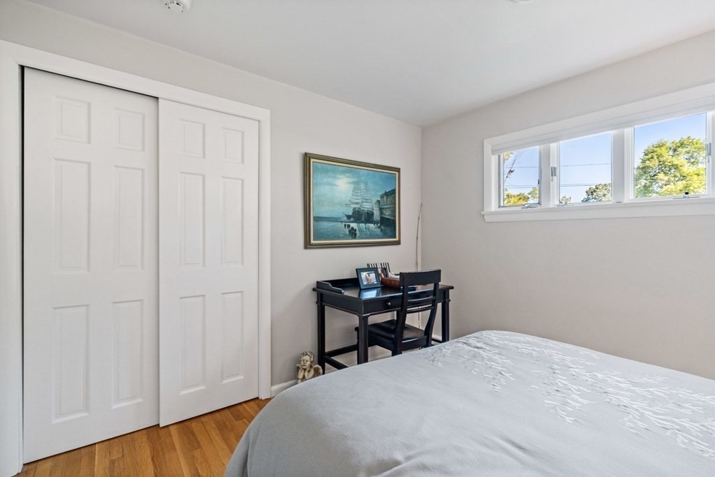 14 Highview Drive Hingham, MA 02043 - Photo 27 of 41 a bedroom with a bed and a table in it