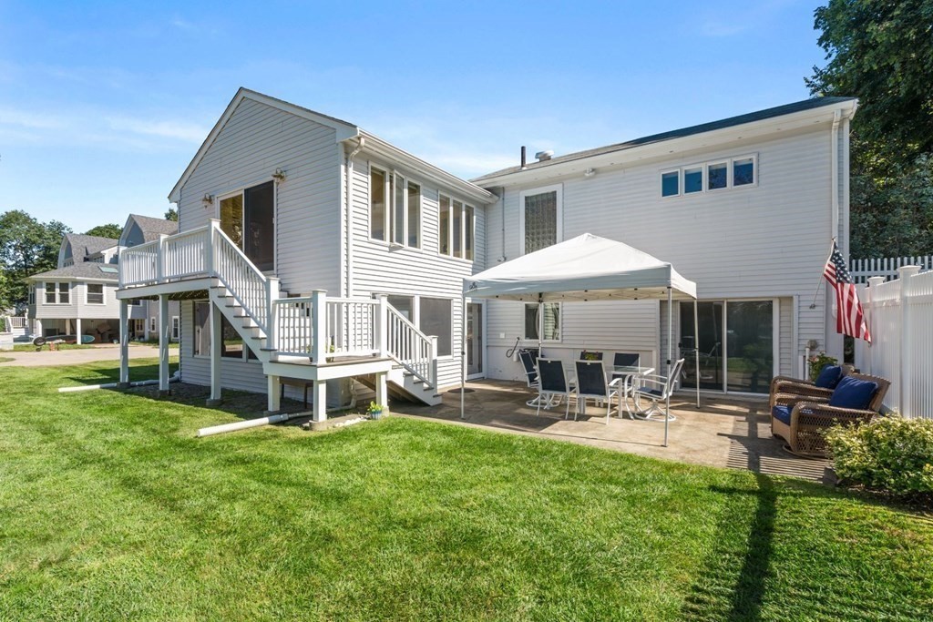 14 Highview Drive Hingham, MA 02043 - Photo 28 of 41 a front view of a house with garden and sitting area