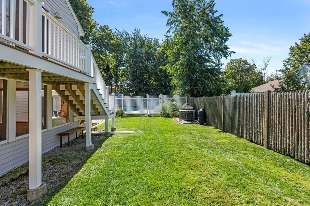 14 Highview Drive Hingham, MA 02043 - Photo 29 of 41 a view of a chair and tables in the backyard of the house
