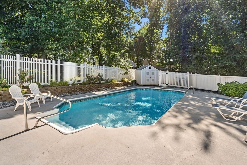 14 Highview Drive Hingham, MA 02043 - Photo 33 of 41 a view of a backyard with chairs potted plants with wooden fence