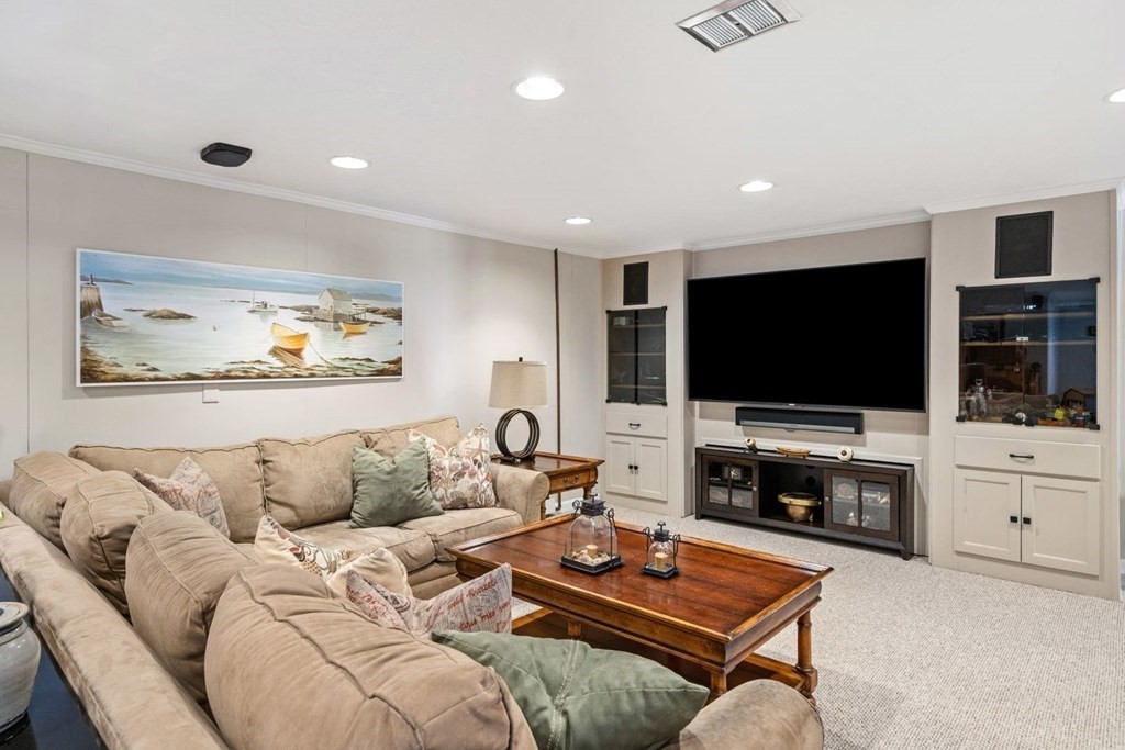 14 Highview Drive Hingham, MA 02043 - Photo 37 of 41 a living room with furniture and a flat screen tv